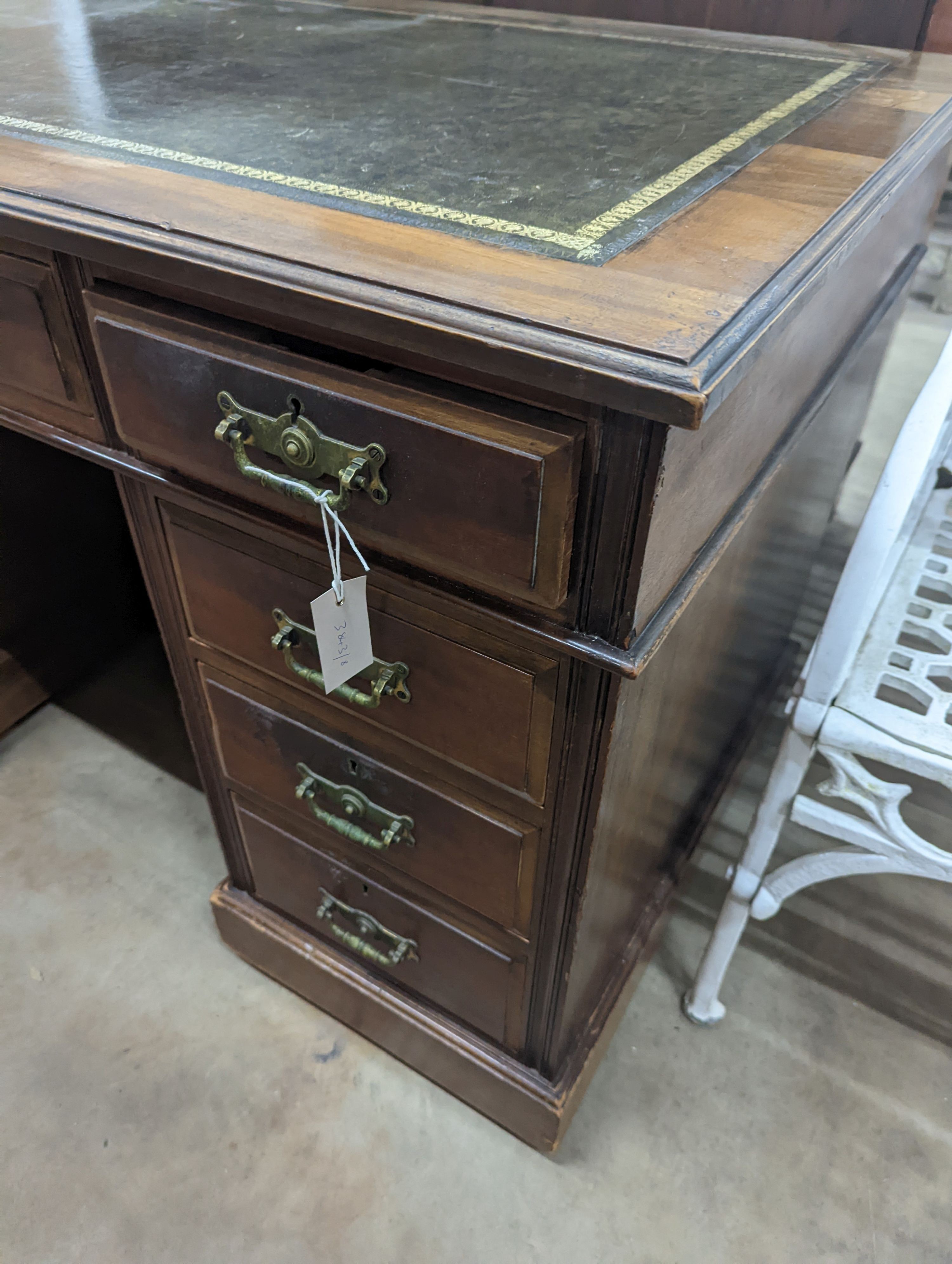 A late Victorian walnut pedestal desk, length 122cm, depth 68cm, height 76cm